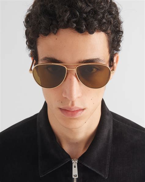 Prada Sunglasses with iconic metal plaque .